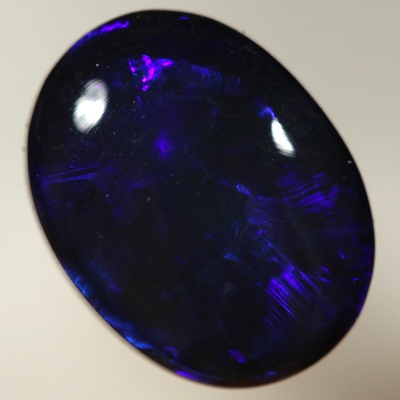SOLID BLACK OPAL Royal blue rolling flashes. SEE VIDEO